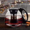 front view cup of tea with lemon cinnamon and kettle on grey bac Чайник заварювальний Kamille KM-0779M